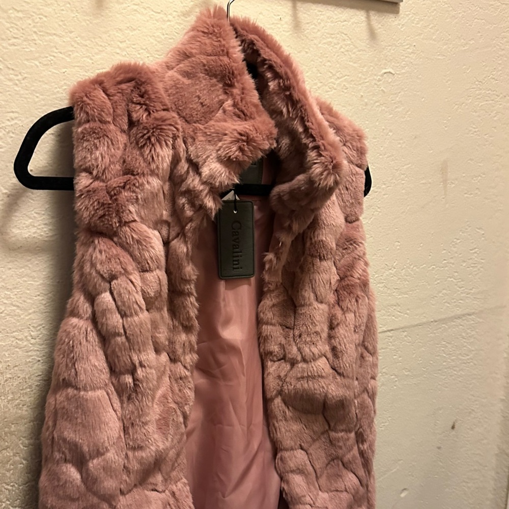 Brand new vest. Never worn. Size Small.